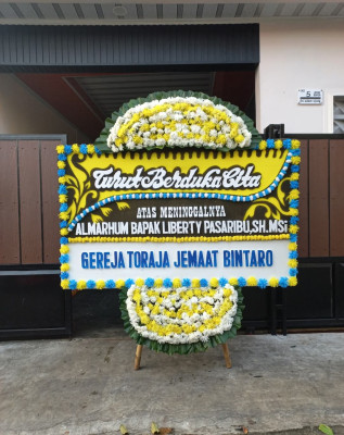 Papan Bunga Duka di Silo